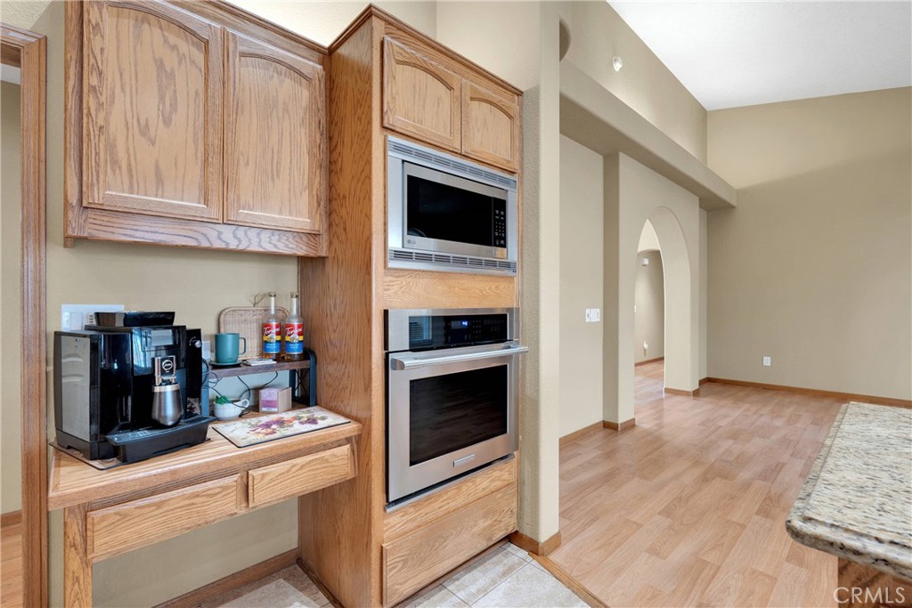 19501 Kinai Road Apple Valley, CA 92307 - Photo 20 of 69 a kitchen with stainless steel appliances granite countertop a stove and a microwave