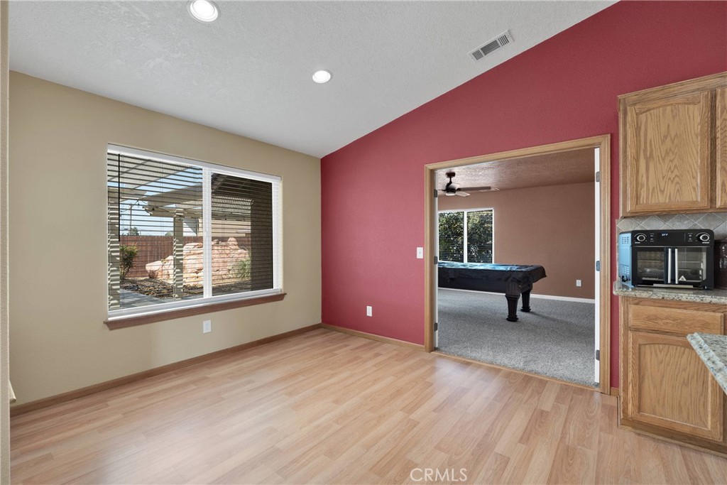 19501 Kinai Road Apple Valley, CA 92307 - Photo 22 of 69 a view of livingroom with furniture wooden floor and window