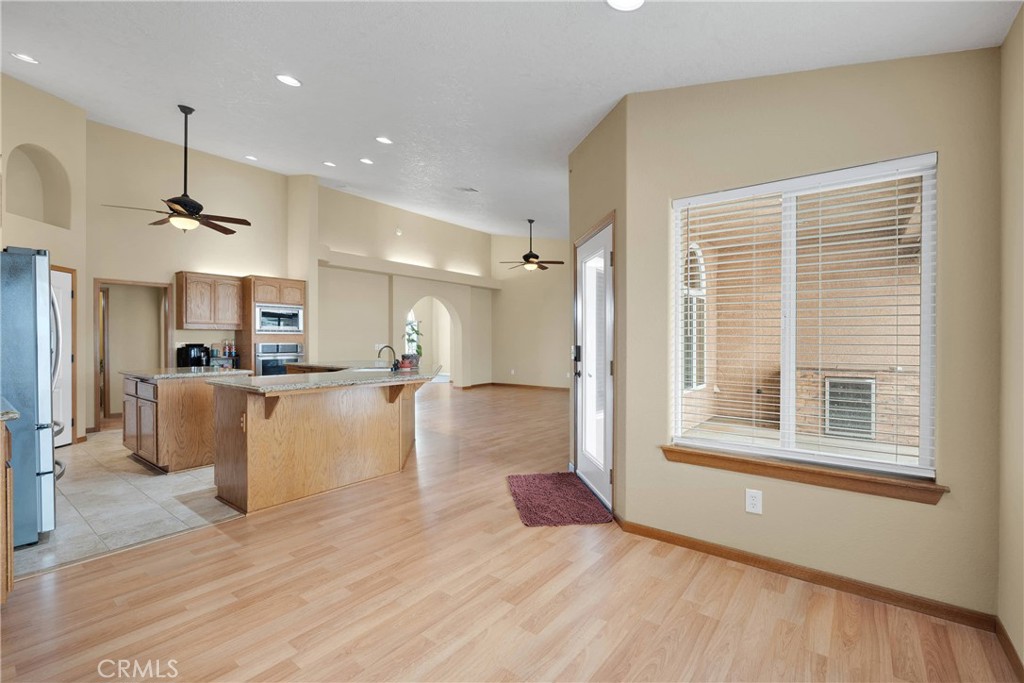 19501 Kinai Road Apple Valley, CA 92307 - Photo 23 of 69 a view of kitchen with furniture and wooden floor