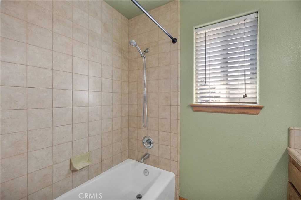 19501 Kinai Road Apple Valley, CA 92307 - Photo 33 of 69 a bathroom with a bathtub and shower