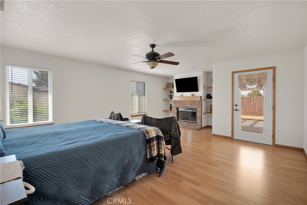 19501 Kinai Road Apple Valley, CA 92307 - Photo 37 of 69 a bed room with a bed and a chandelier