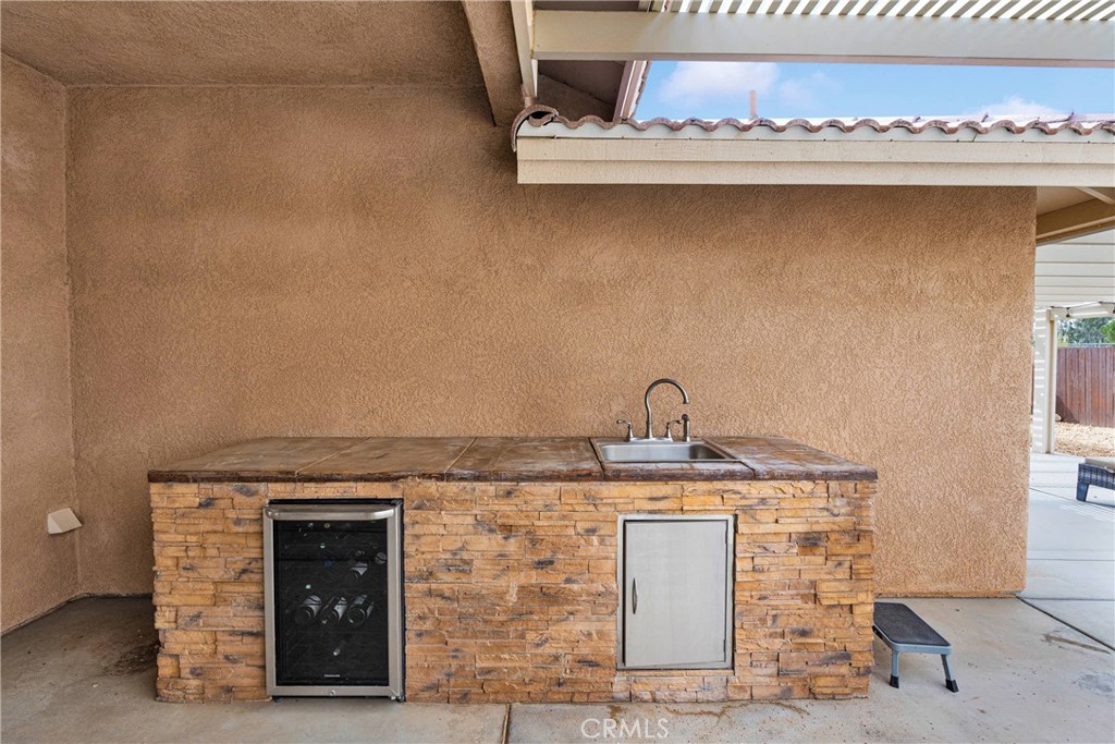 19501 Kinai Road Apple Valley, CA 92307 - Photo 44 of 69 a room with a stove and a sink