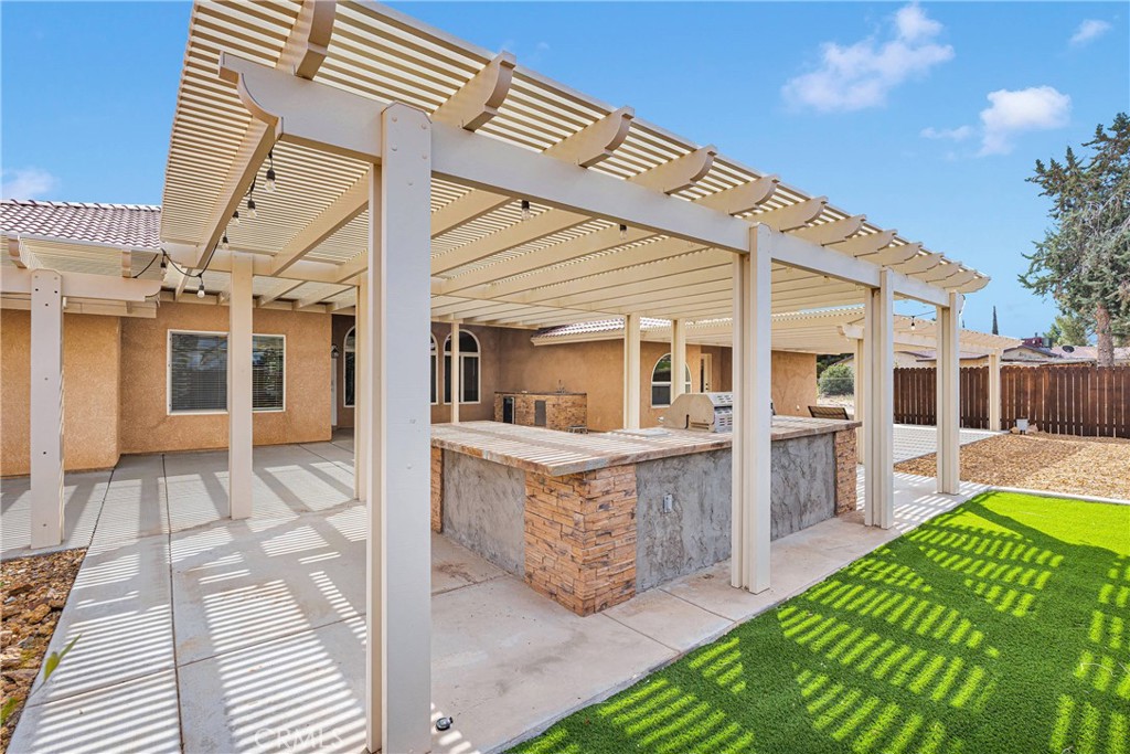 19501 Kinai Road Apple Valley, CA 92307 - Photo 49 of 69 a view of house with patio and yard