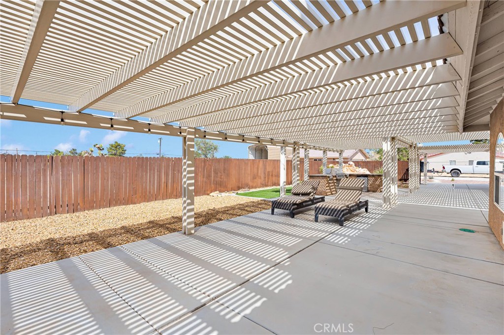 19501 Kinai Road Apple Valley, CA 92307 - Photo 51 of 69 a backyard of a house with table and chairs