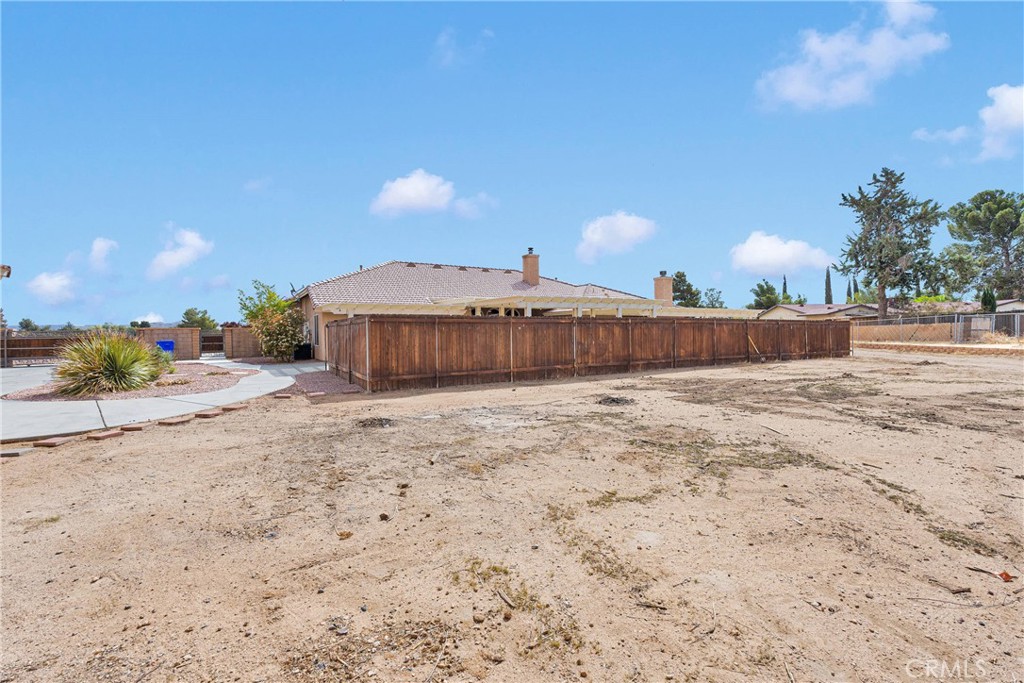 19501 Kinai Road Apple Valley, CA 92307 - Photo 53 of 69 a front view of a house with a yard and covered with snow