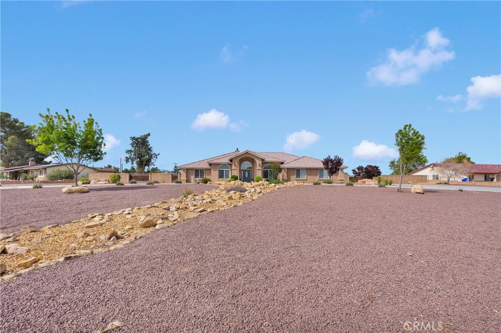 19501 Kinai Road Apple Valley, CA 92307 - Photo 57 of 69 a view of a road with a building in the background
