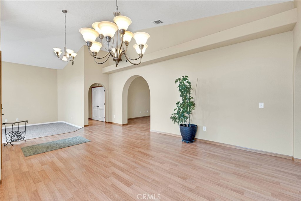 19501 Kinai Road Apple Valley, CA 92307 - Photo 6 of 69 a view of a dining room with wooden floor