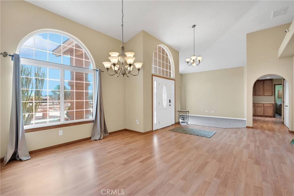 19501 Kinai Road Apple Valley, CA 92307 - Photo 7 of 69 a view of livingroom with hardwood floor and window