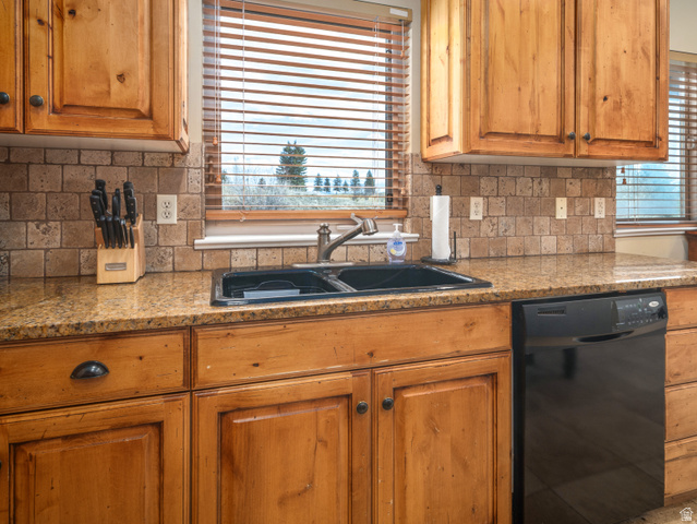 5184 Fairview Loop Eden, UT 84310 - Photo 6 of 54 Kitchen featuring a double basin sink with a bronze-finish faucet, granite-finish countertops, and wood-finish cabinetry