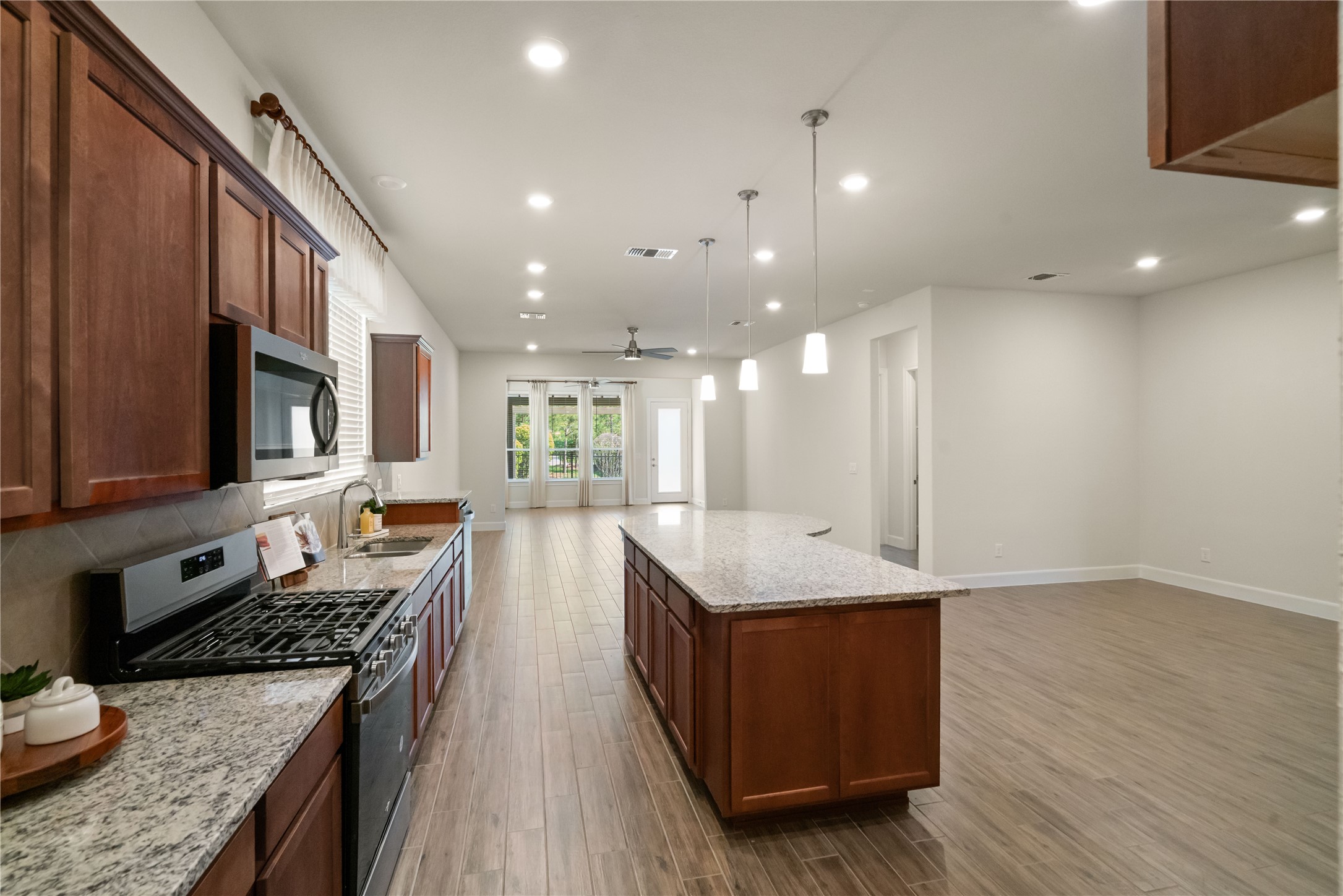 516 Nokota Drive Spring, TX 77382 - Photo 5 of 33 Dining area is to the right of the island and easily accommodates seating for 6-8.