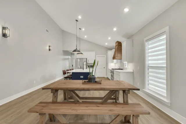 a white stove top oven sitting inside of a kitchen
