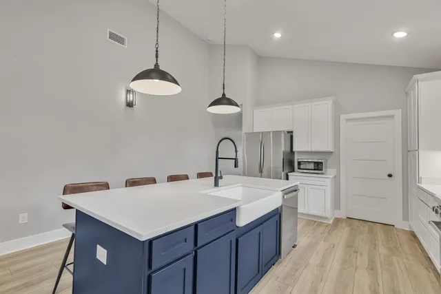 a white bath tub sitting next to a shower