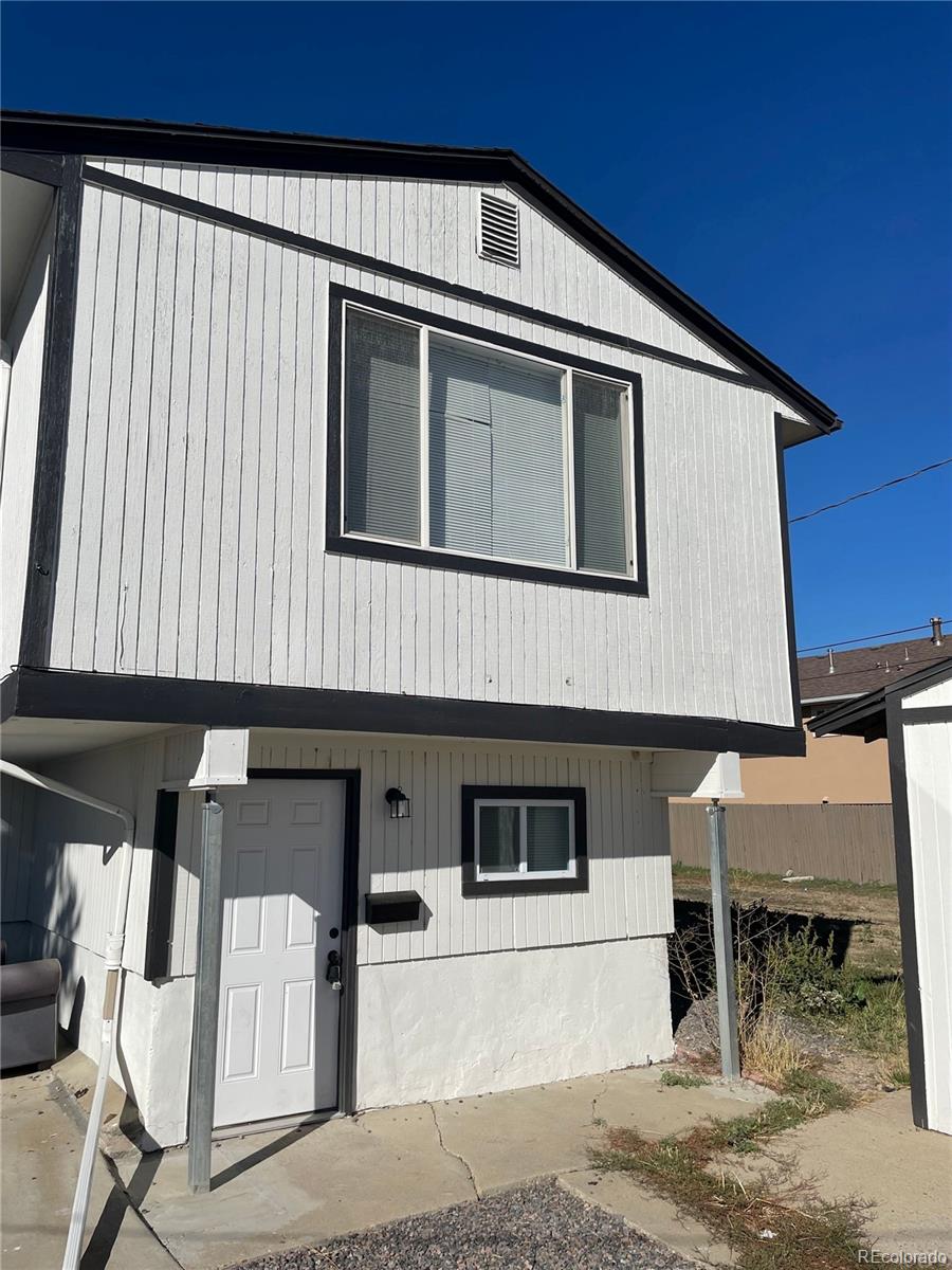 3210 West Longfellow Place Denver, CO 80221 - Photo 2 of 36 a front view of a house with stairs