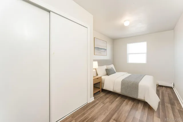 a room with a bed and a window