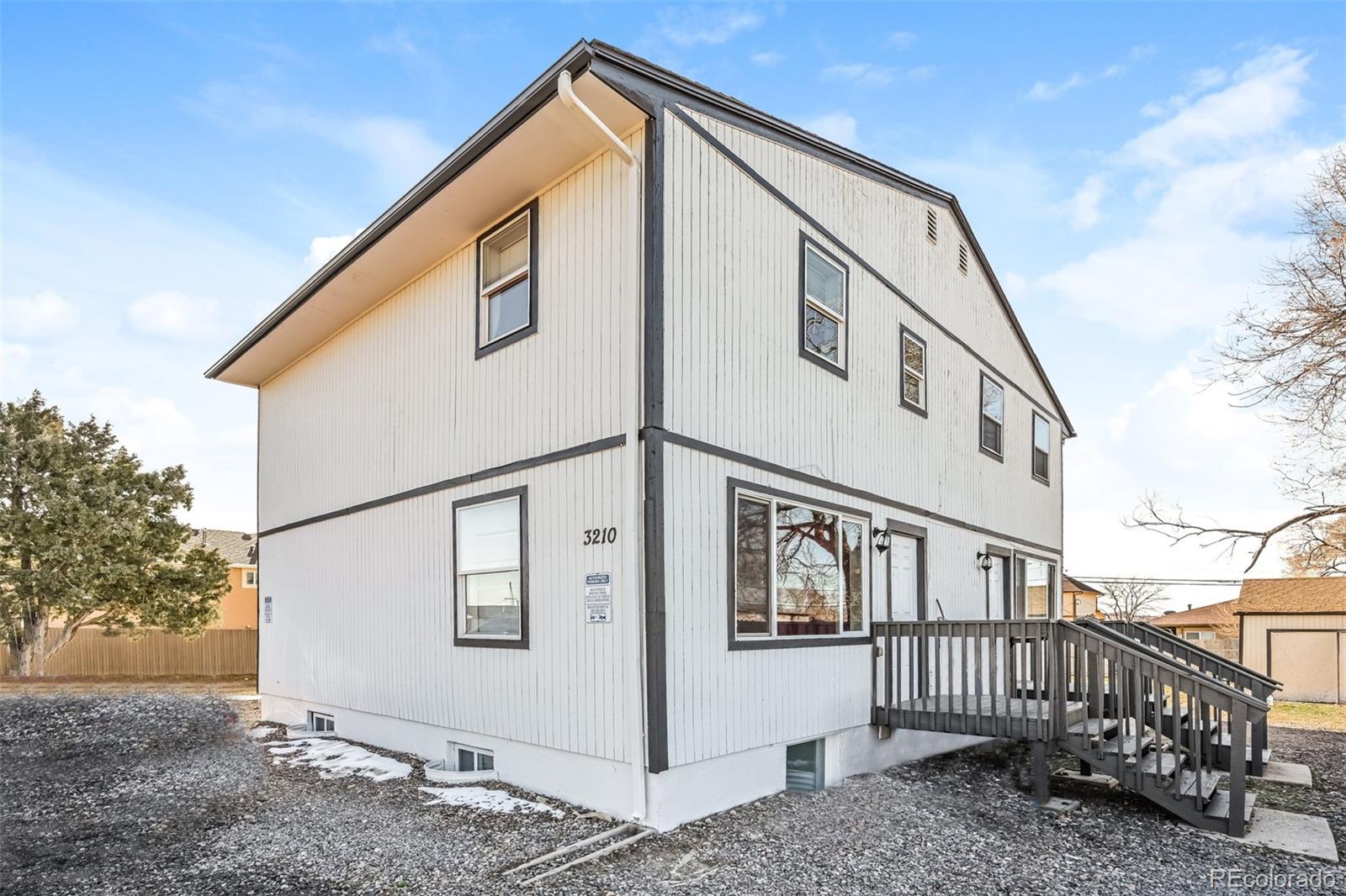 3210 West Longfellow Place Denver, CO 80221 - Photo 3 of 36 a view of a house with a street