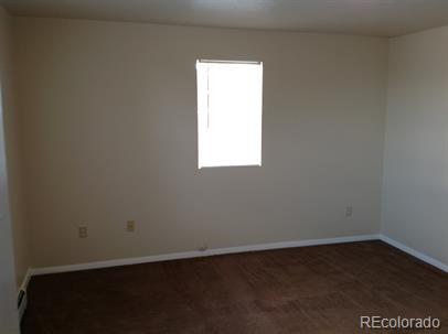 3210 West Longfellow Place Denver, CO 80221 - Photo 35 of 36 an empty room with a window