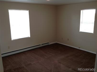 3210 West Longfellow Place Denver, CO 80221 - Photo 36 of 36 an empty room with a window