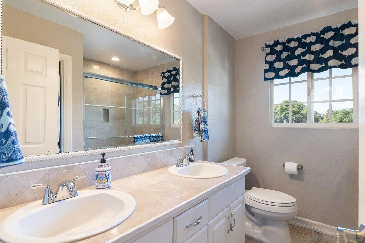 40158 De Luz Road Fallbrook, CA 92028 - Photo 20 of 40 a bathroom with a sink a toilet and shower