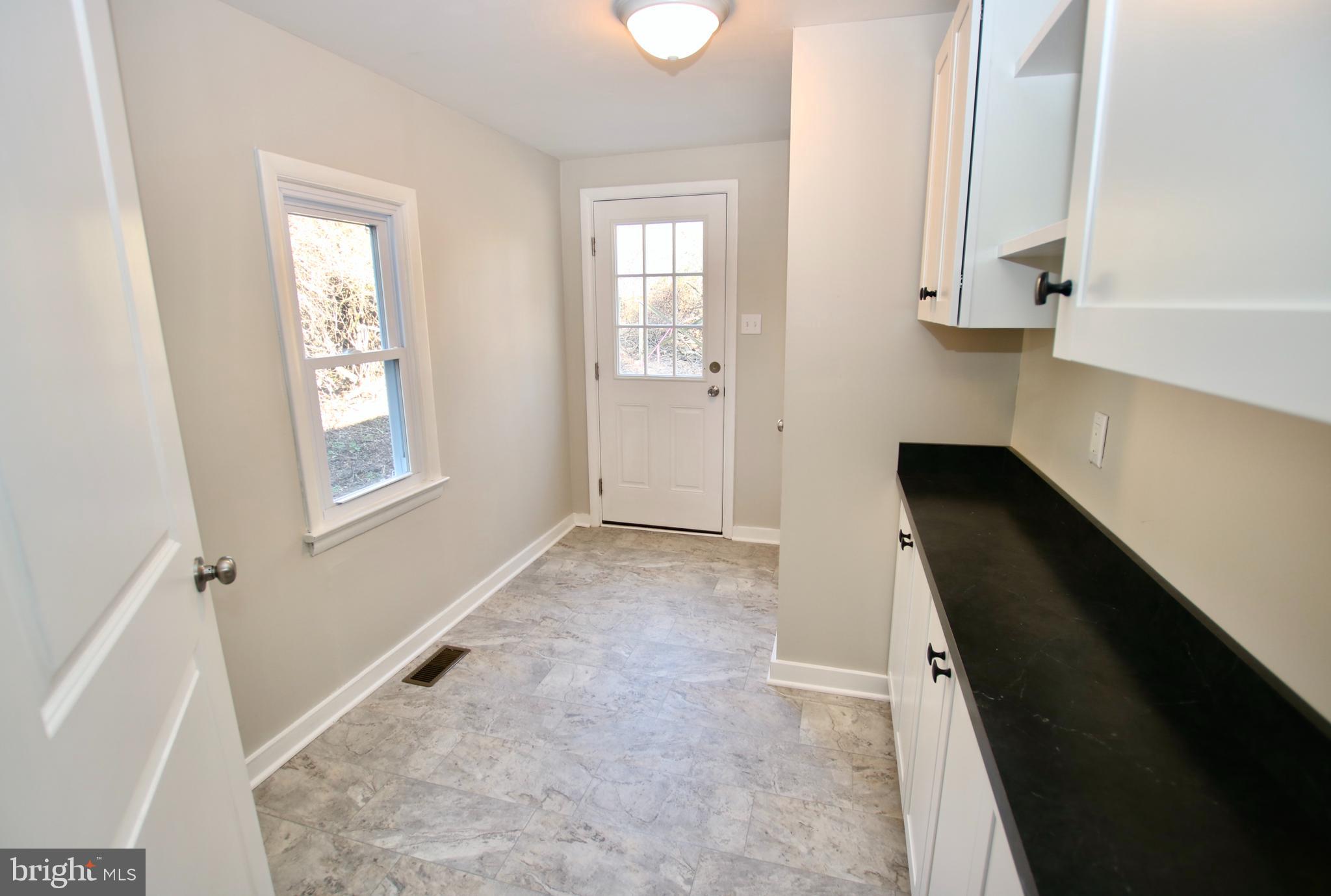 3373 Slate Mills Road Sperryville, VA 22740 - Photo 16 of 25 Laundry/Mudroom with new flooring and cabinets