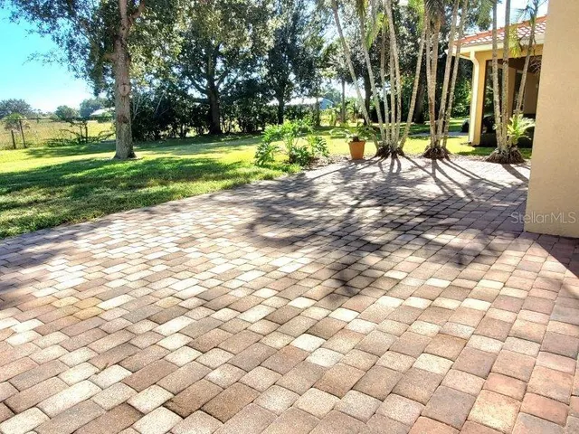a kitchen with stainless steel appliances kitchen island sink refrigerator and microwave