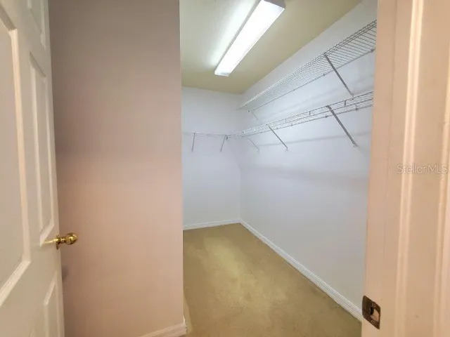 a large spacious bathroom with a large tub and sink