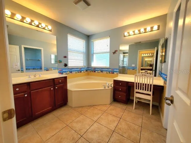 a bathroom with a tub and shower