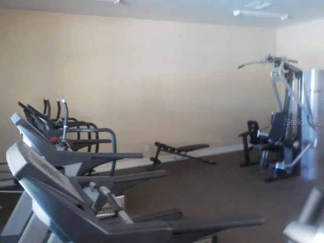 a close view of a sink a table and chairs in a room