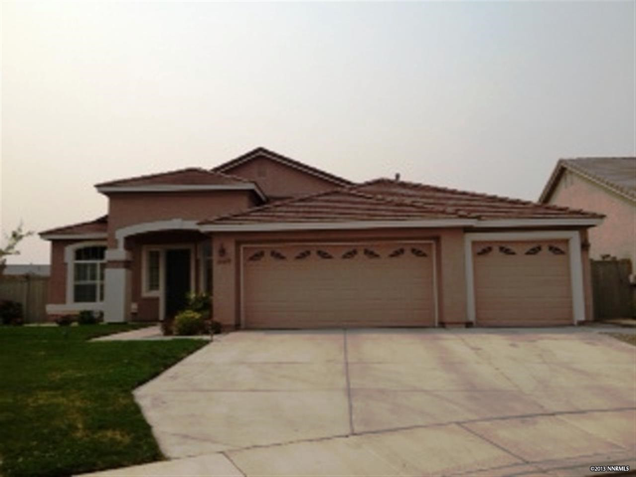10450 Canyon Country Court Reno, NV 89521 - Photo 1 of 1 a front view of a house with a garage