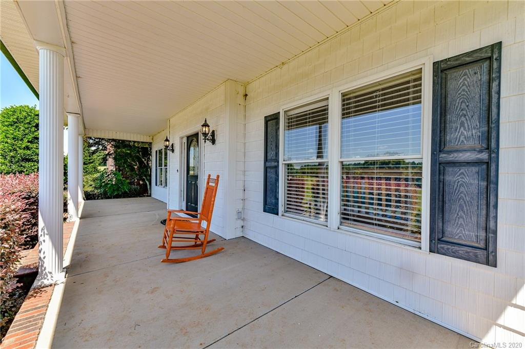 150 North Moose Road Mount Pleasant, NC 28124 - Photo 2 of 32 a view of a room with furniture and floor to ceiling window