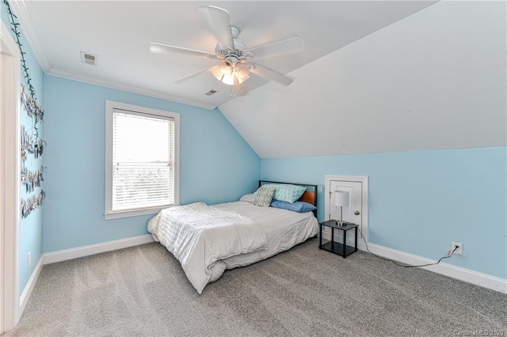 150 North Moose Road Mount Pleasant, NC 28124 - Photo 18 of 32 a spacious bedroom with a bed and window