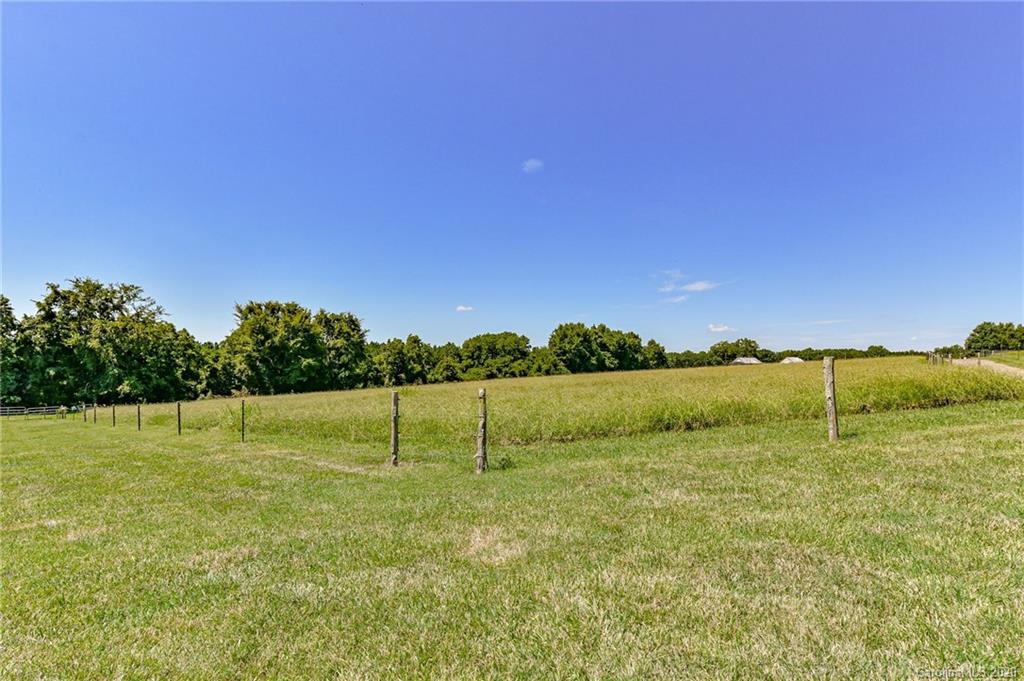 150 North Moose Road Mount Pleasant, NC 28124 - Photo 25 of 32 a view of outdoor space with green field and trees