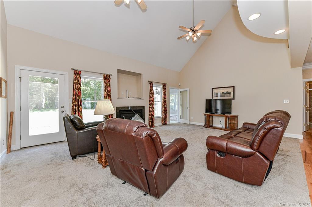 150 North Moose Road Mount Pleasant, NC 28124 - Photo 5 of 32 a living room with furniture and a chandelier