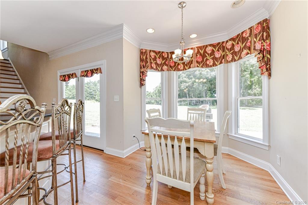 150 North Moose Road Mount Pleasant, NC 28124 - Photo 10 of 32 a view of a dining room with furniture window and wooden floor
