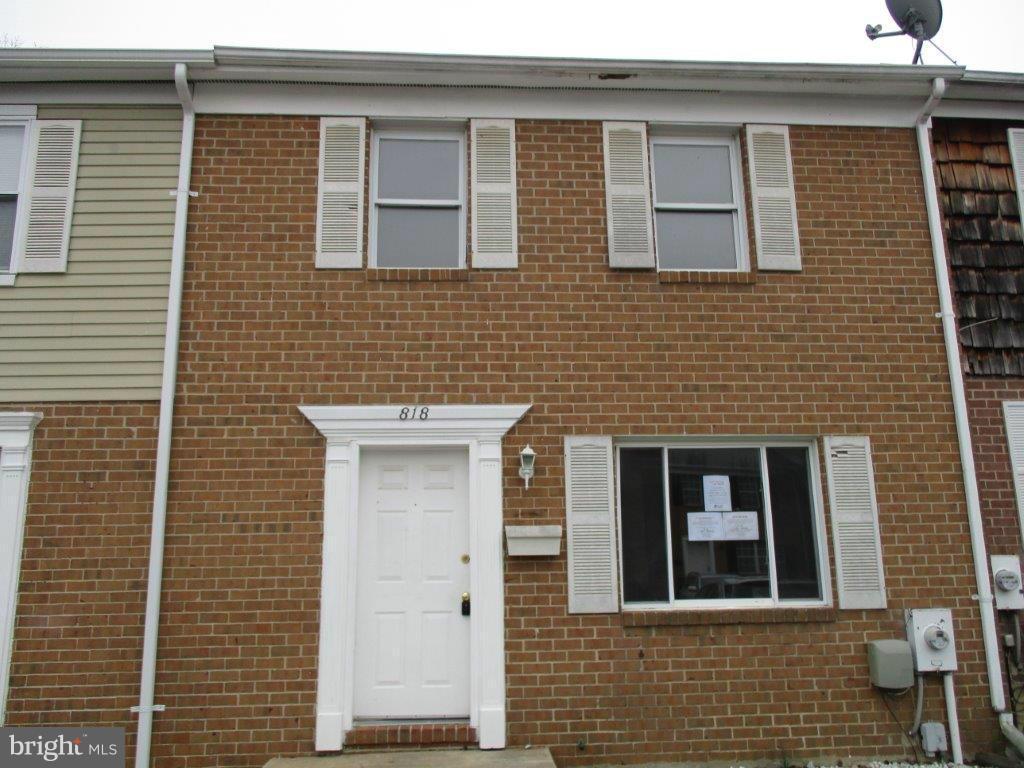 818 Thimbleberry Road Baltimore, MD 21220 - Photo 1 of 12 a brick house with a door