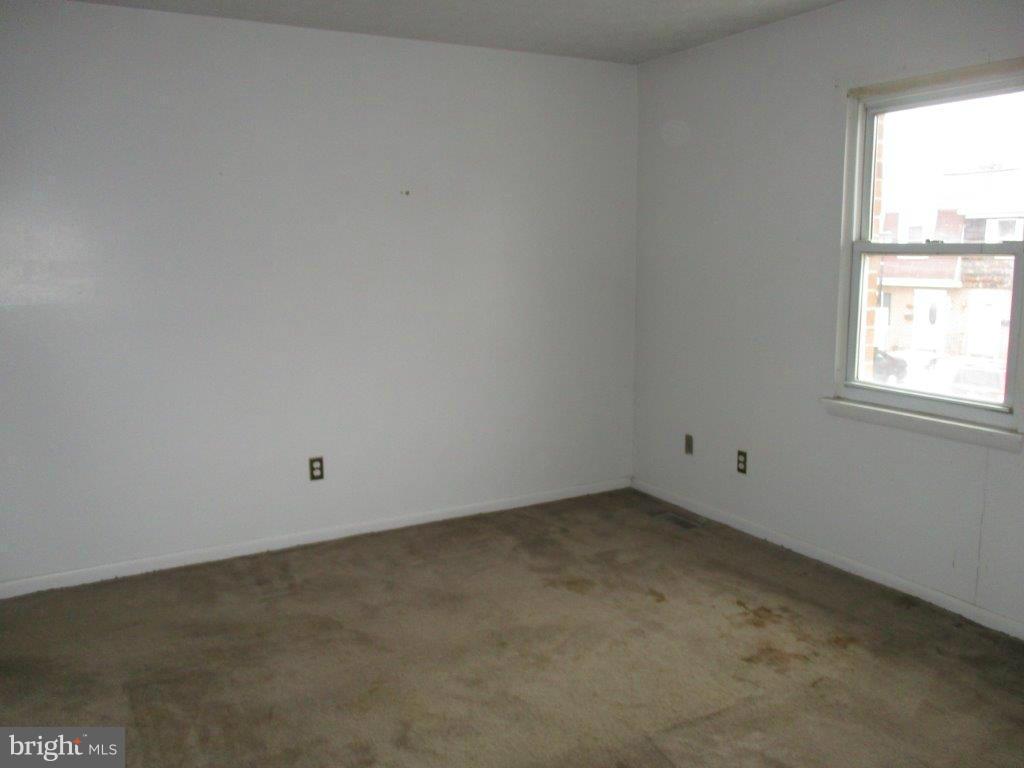 818 Thimbleberry Road Baltimore, MD 21220 - Photo 8 of 12 an empty room with a window
