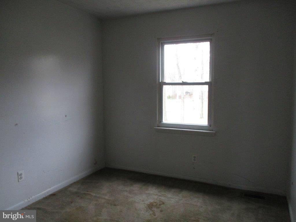 818 Thimbleberry Road Baltimore, MD 21220 - Photo 10 of 12 an empty room with a window