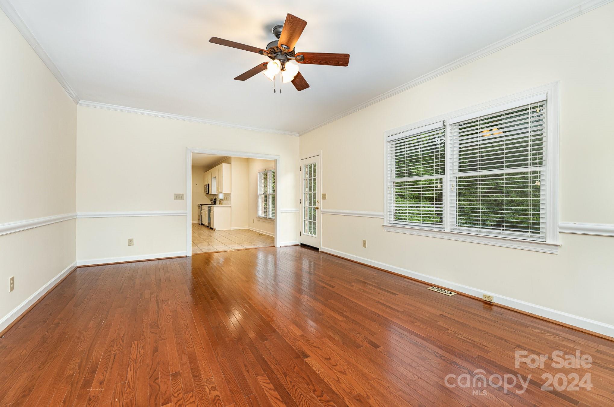 127 Polo Drive Salisbury, NC 28144 - Photo 11 of 31 a view of an empty room with wooden floor and a window