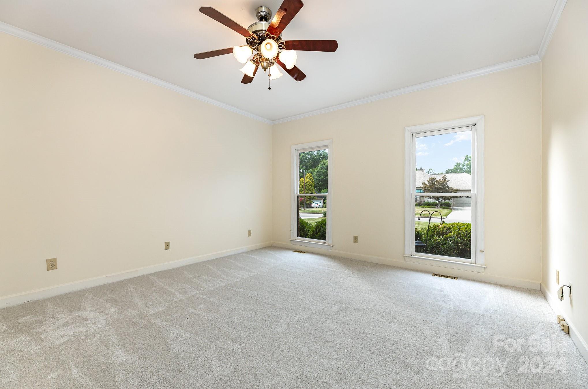 127 Polo Drive Salisbury, NC 28144 - Photo 13 of 31 an empty room with windows and fan