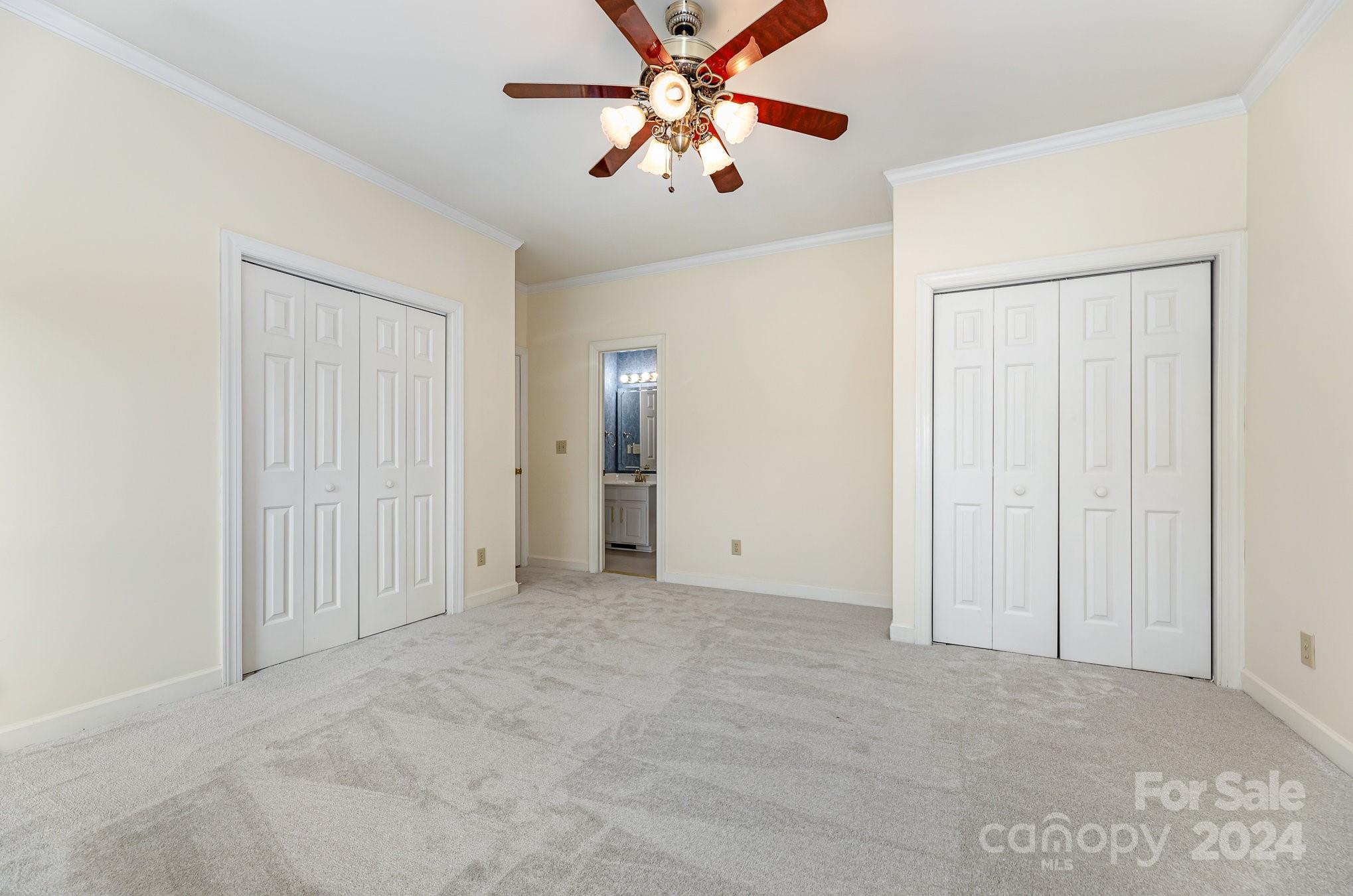 127 Polo Drive Salisbury, NC 28144 - Photo 14 of 31 an empty room with closet and a chandelier fan