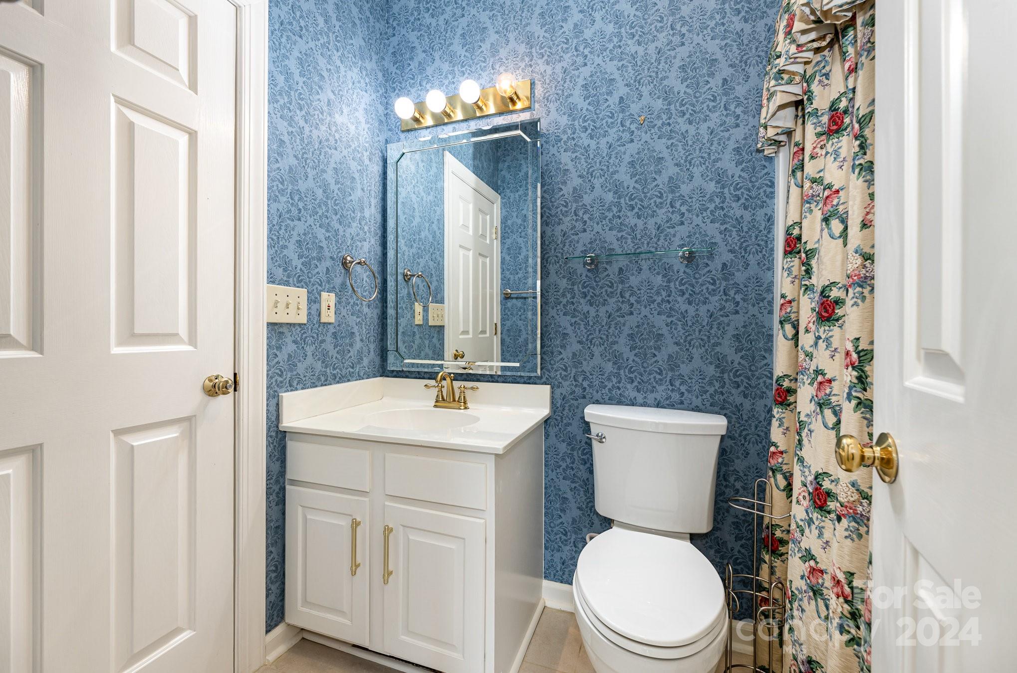 127 Polo Drive Salisbury, NC 28144 - Photo 15 of 31 a bathroom with a toilet sink and mirror