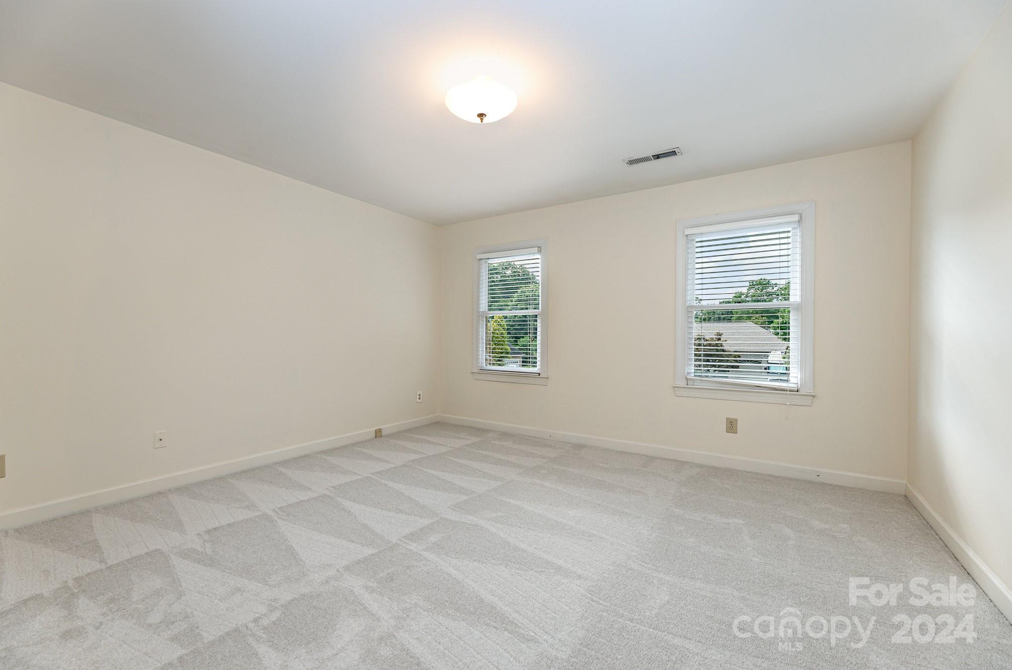 127 Polo Drive Salisbury, NC 28144 - Photo 19 of 31 an empty room with windows