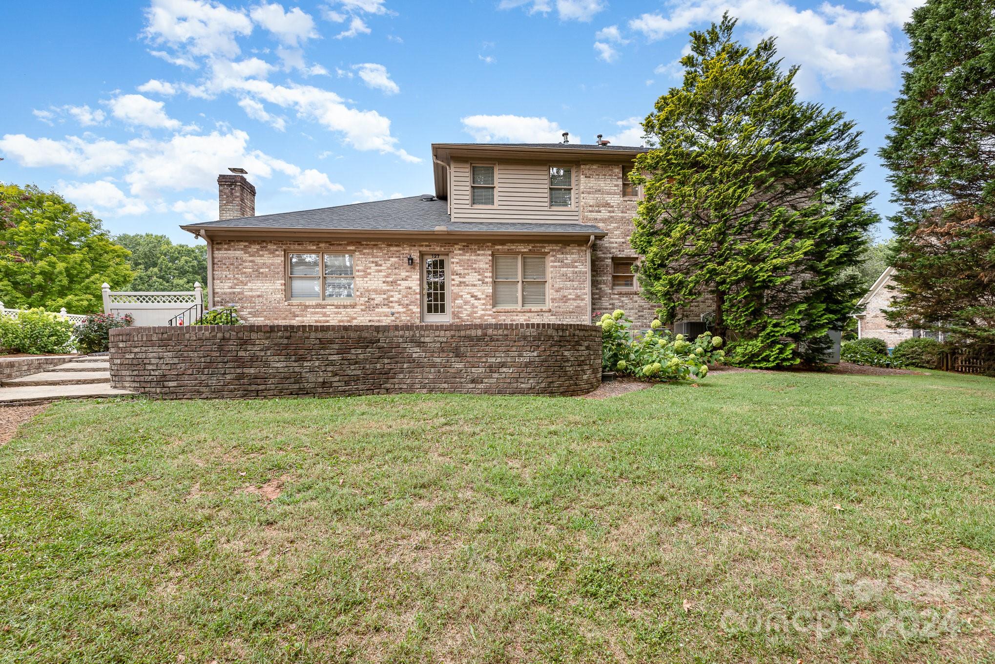 127 Polo Drive Salisbury, NC 28144 - Photo 25 of 31 a front view of a house with a yard