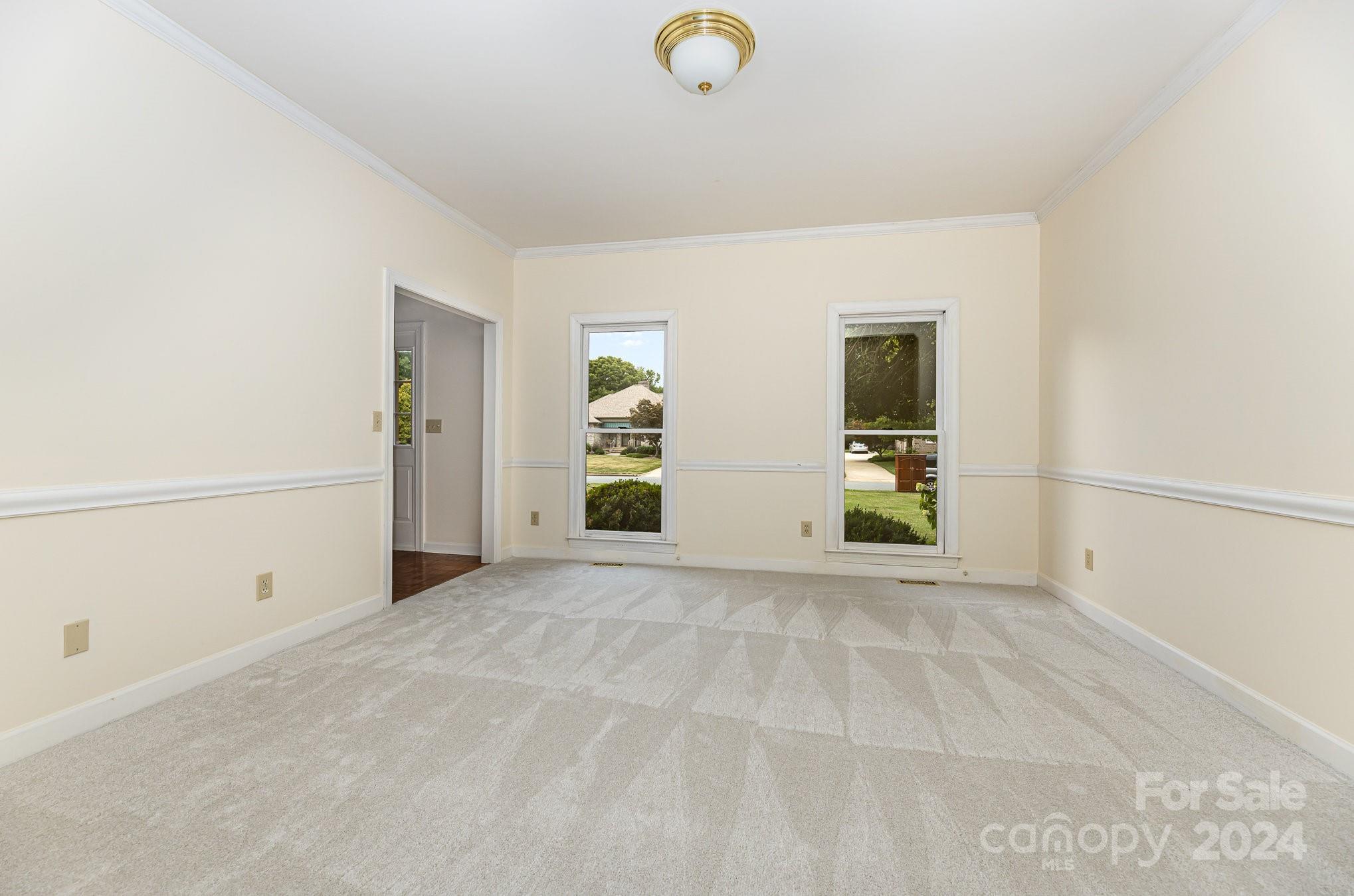 127 Polo Drive Salisbury, NC 28144 - Photo 3 of 31 an empty room with closet and mirrors