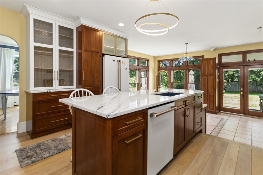 29 Boulevard Road Dedham, MA 02026 - Photo 4 of 34 a kitchen with granite countertop a stove and a sink