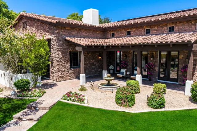 a view of a chair and tables in the patio