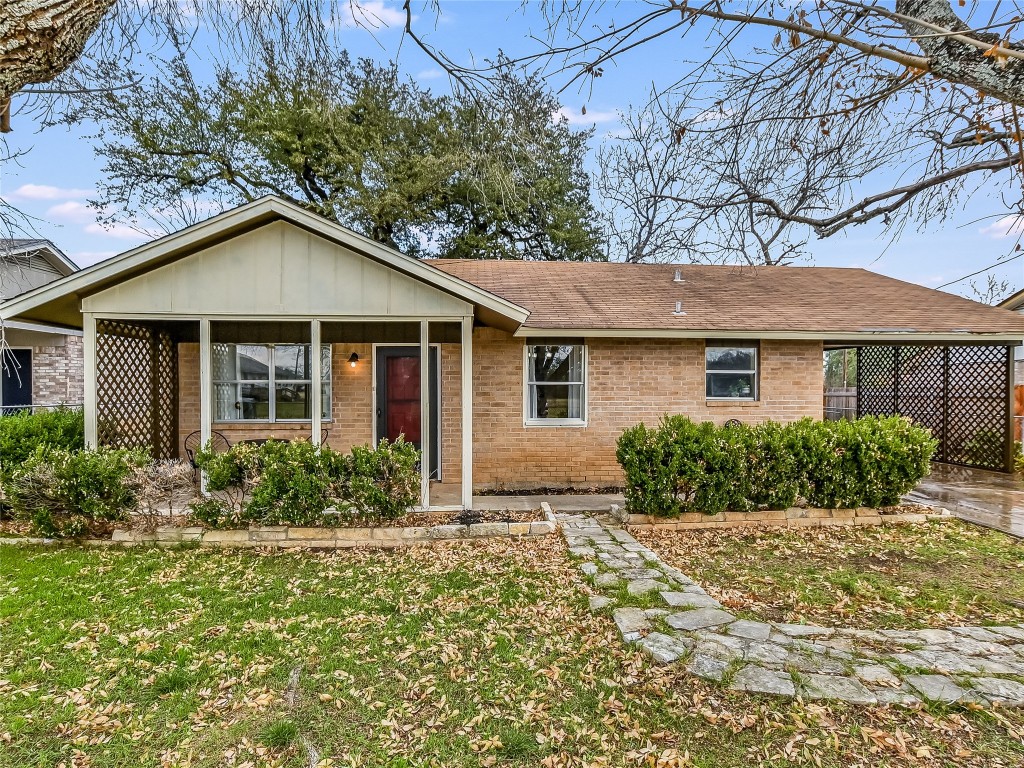 502 West 1st Street Kyle, TX 78640 - Photo 1 of 1 a front view of house with yard and green space