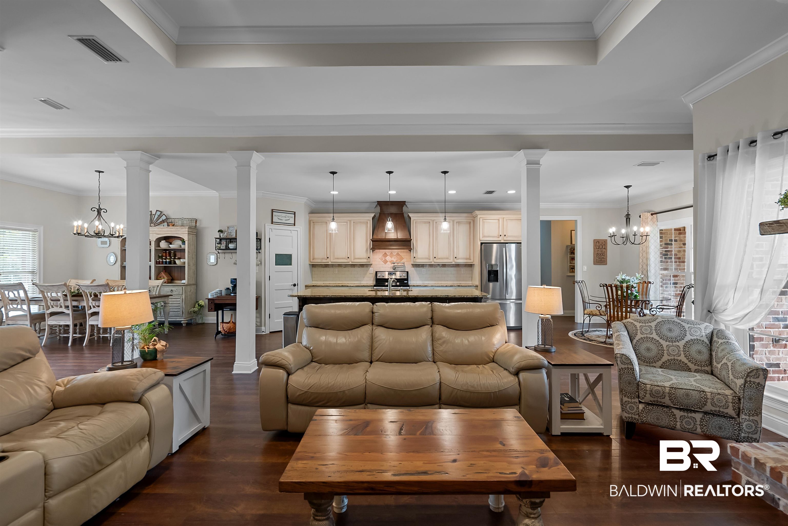 12070 Comalander Road Fairhope, AL 36532 - Photo 10 of 50 Open-concept living area featuring dark wood-finish flooring, white tray ceilings, and recessed lighting