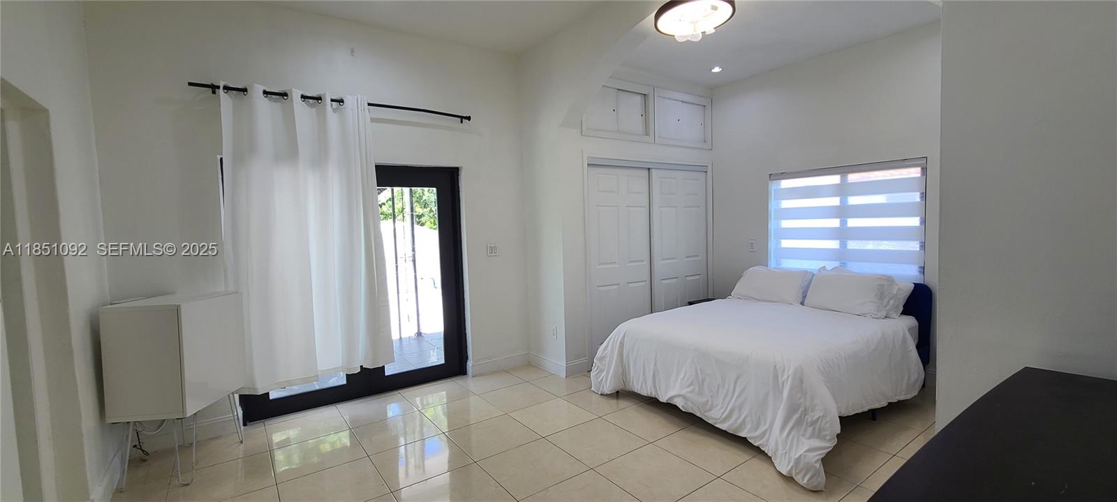 1721 Southwest 24th Terrace Miami, FL 33145 - Photo 48 of 80 a bedroom with a bed and a window