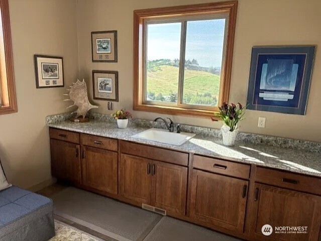 4062 Knowles Road Wenatchee, WA 98801 - Photo 13 of 20 a bathroom with a granite countertop sink mirror and window