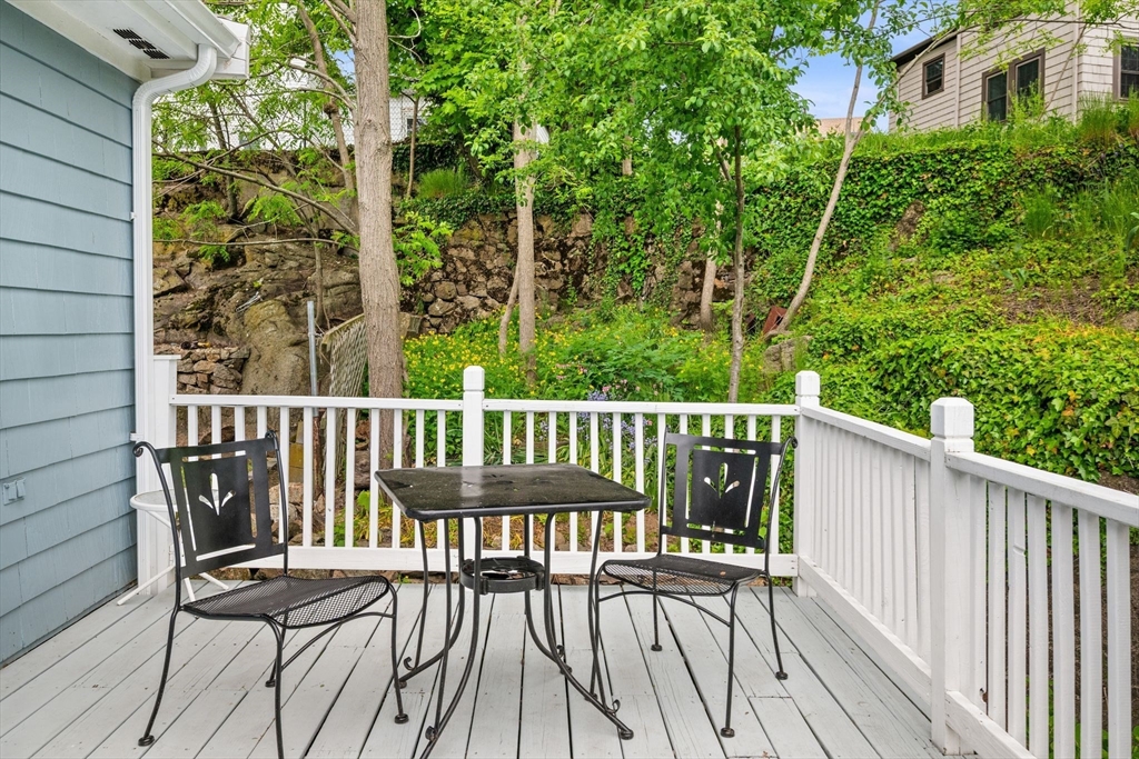 8 Baker Avenue Beverly, MA 01915 - Photo 28 of 40 a view of a wooden chairs and bench in the balcony